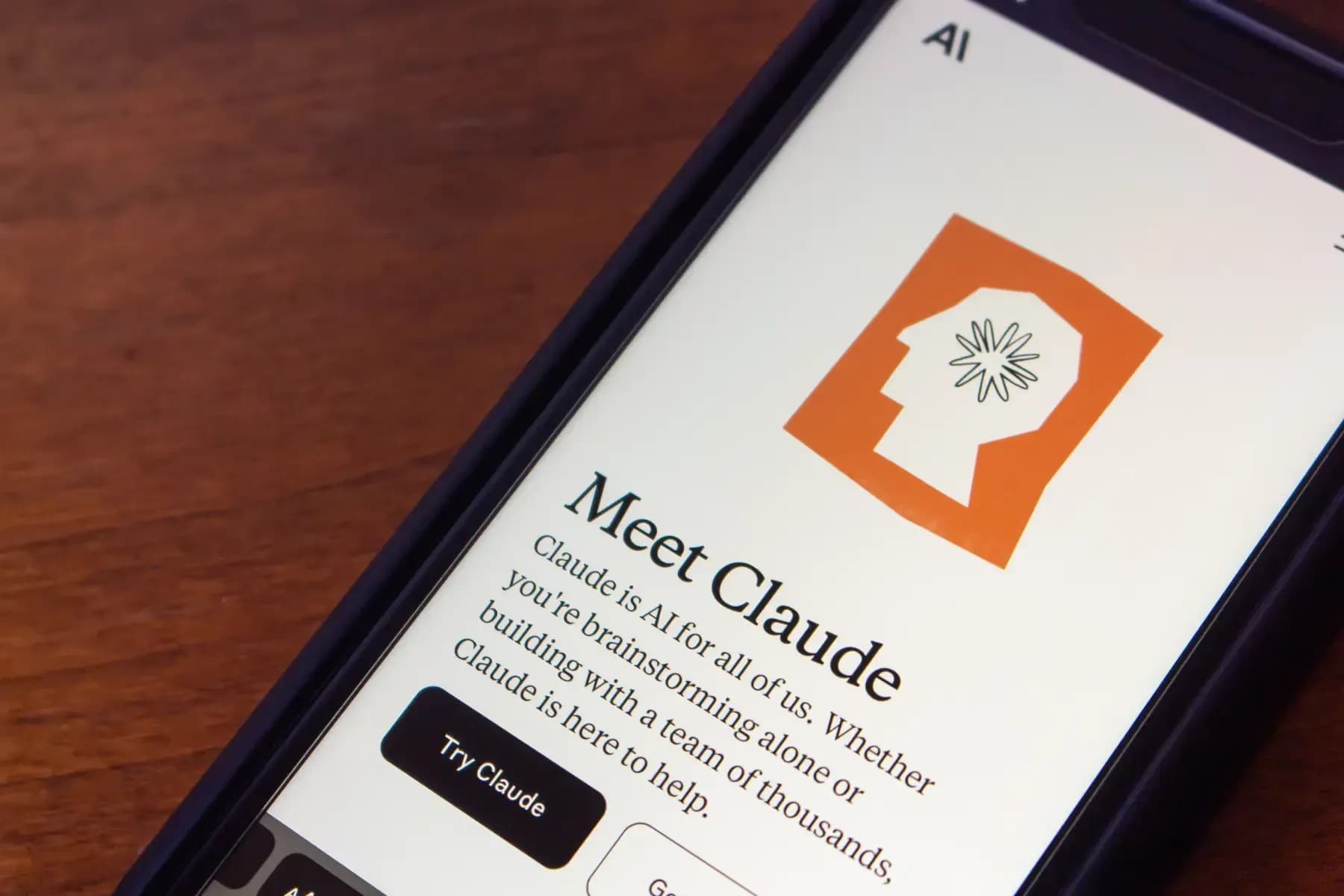 Smartphone displaying the Claude AI app interface with the “Meet Claude” introduction screen.